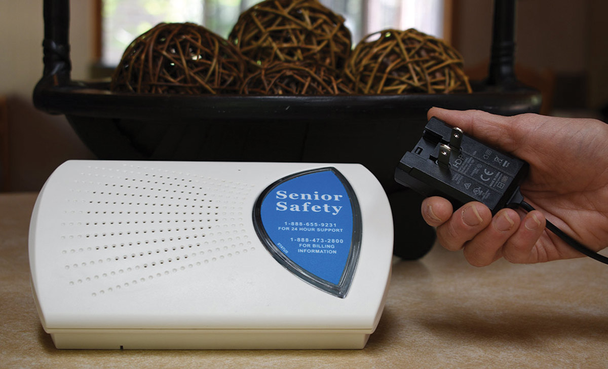 senior safety monitor with hand holding plug